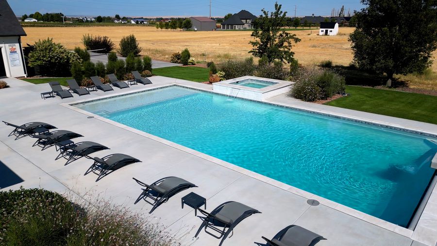 Aerial view of the pool terrace, lawns and sport court
